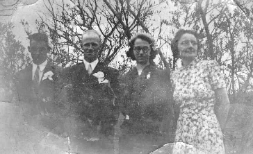 [Photo of wedding group]